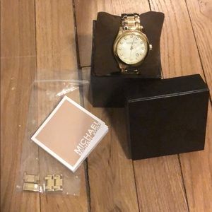 Used gold Michael Kors woman’s watch